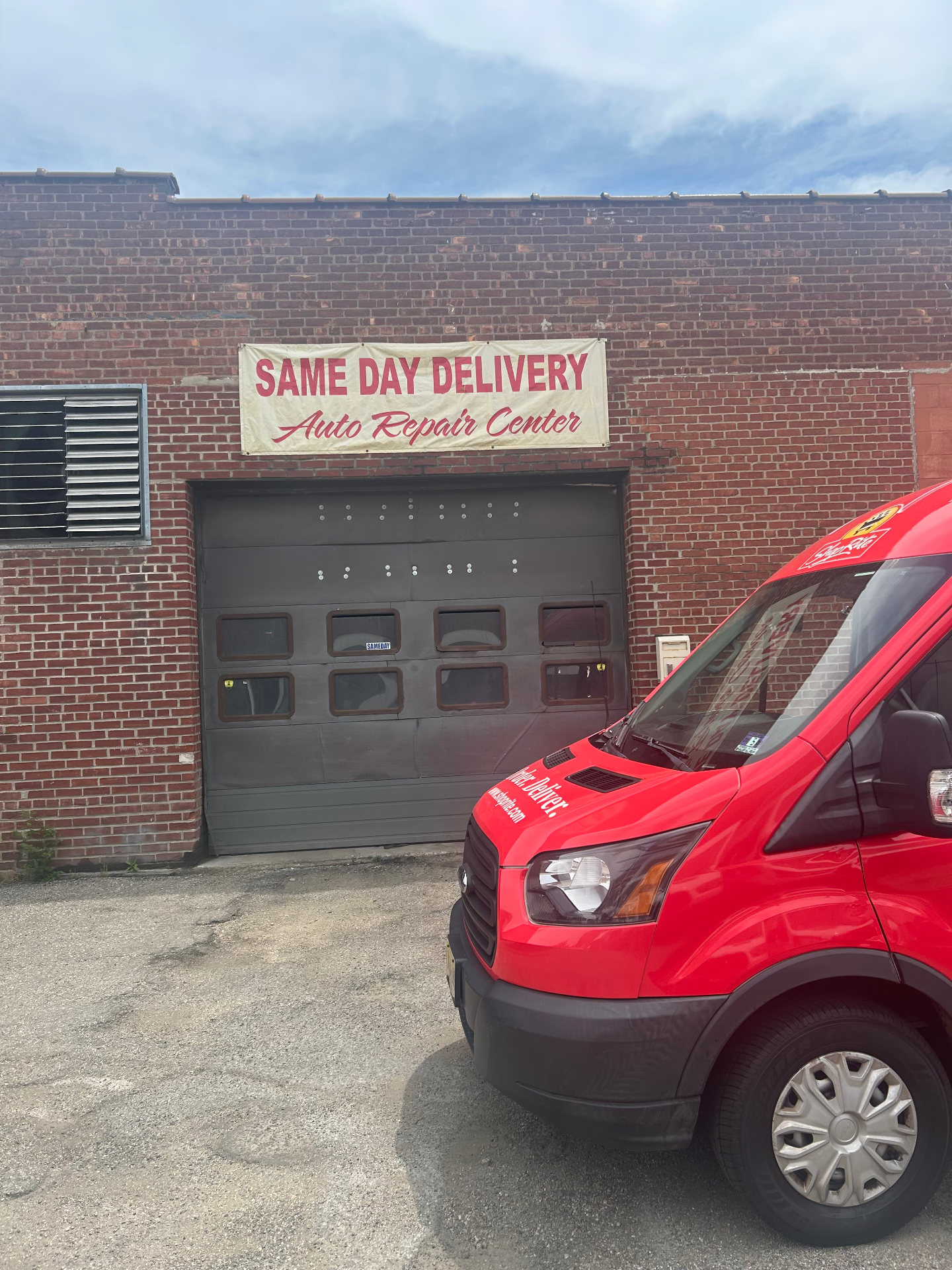SameDay Delivery Auto Repair Center facility with branded van
